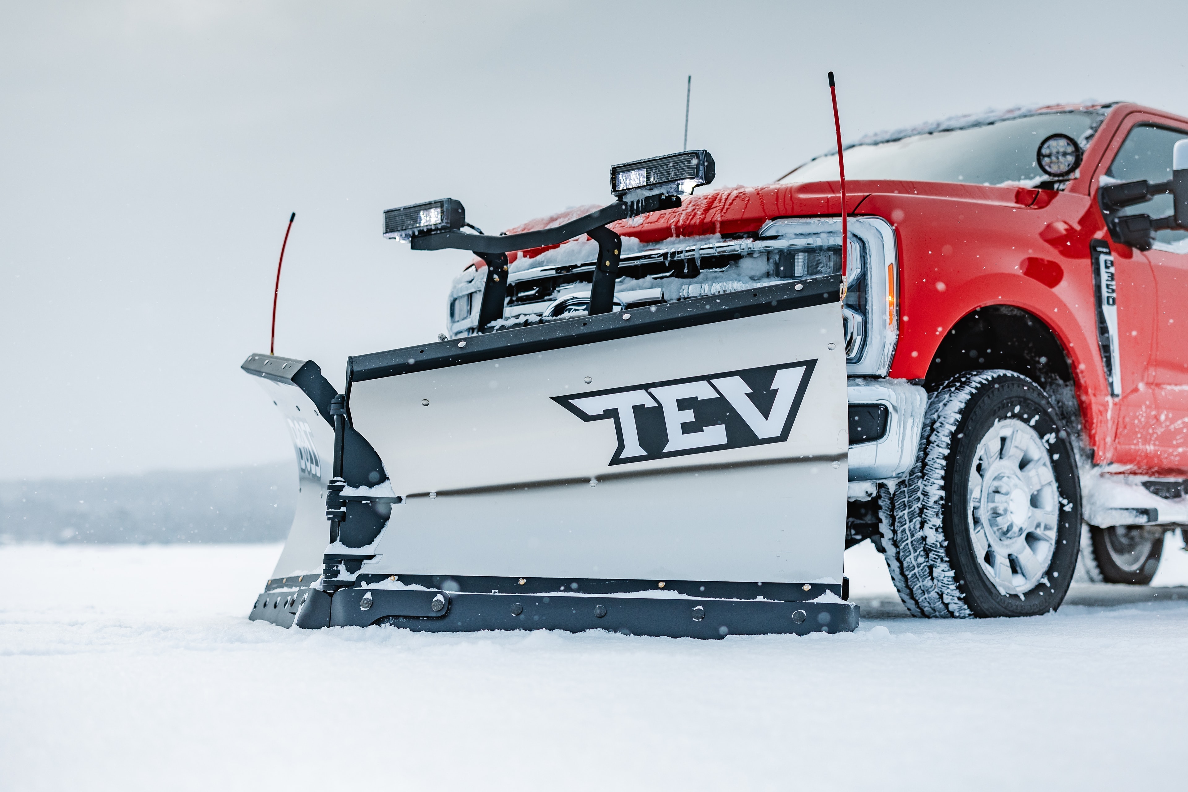 BOSS TEV 8' 2" Tripedge stainless steel snow plow on truck