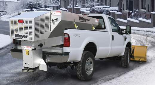 White pickup truck with Meyer plow and yellow insert hopper spreader
